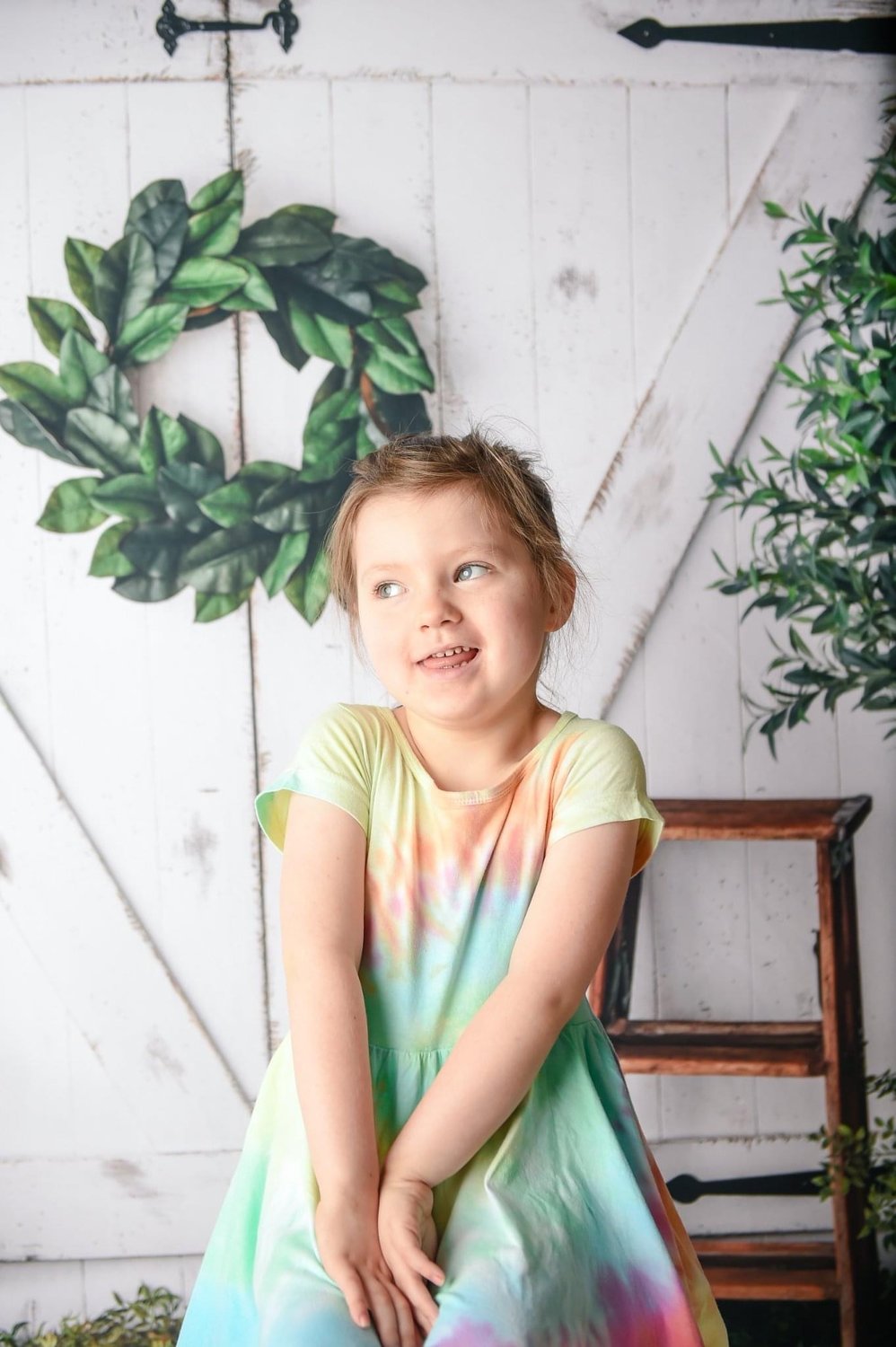 Kenzie Scoggins, 5, poses for a portrait. Kenzie died from an aggressive childhood brain tumor called diffuse pontine glioma on Sept. 18. Her mother, Meghan, called Kenzie 'their tie-dye hippie chick.'